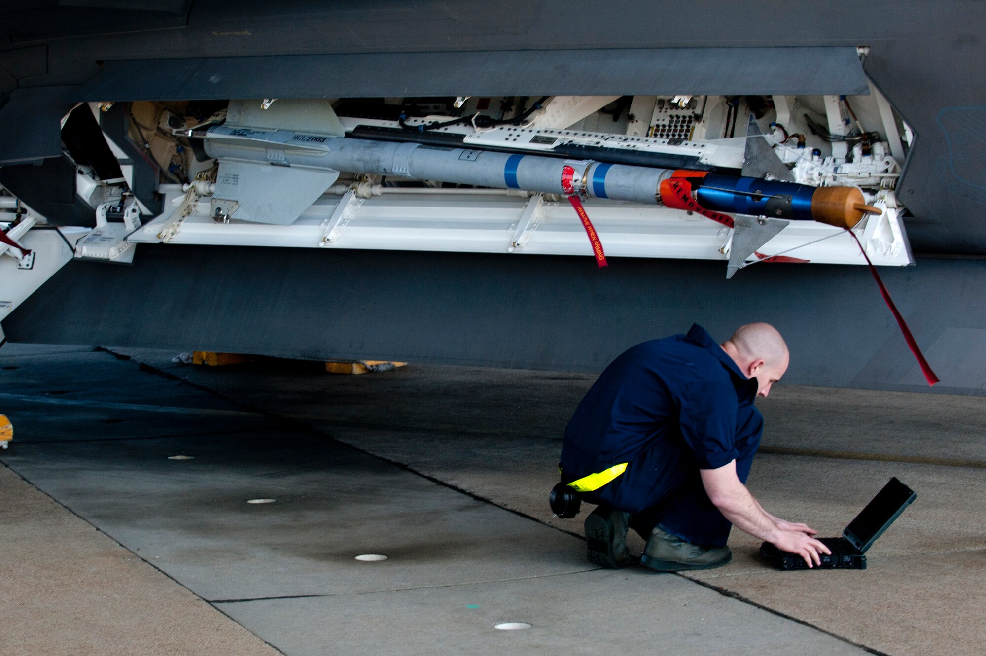 U.S. Air Force Staff Sgt. Aaron Cridge, a weapons load crew team chief assigned to the 27th Aircraft Maintenance Unit, competes during the Second Quarter Weapons Load competition at Langley Air Force Base, Va., April 8, 2016. The competition included a uniform inspection, 20-question test, toolkit inspection and an evaluated weapons load. (U.S. Air Force photo by Senior Airman R. Alex Durbin/Released)