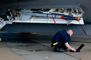 U.S. Air Force Staff Sgt. Aaron Cridge, a weapons load crew team chief assigned to the 27th Aircraft Maintenance Unit, competes during the Second Quarter Weapons Load competition at Langley Air Force Base, Va., April 8, 2016. The competition included a uniform inspection, 20-question test, toolkit inspection and an evaluated weapons load. (U.S. Air Force photo by Senior Airman R. Alex Durbin/Released)