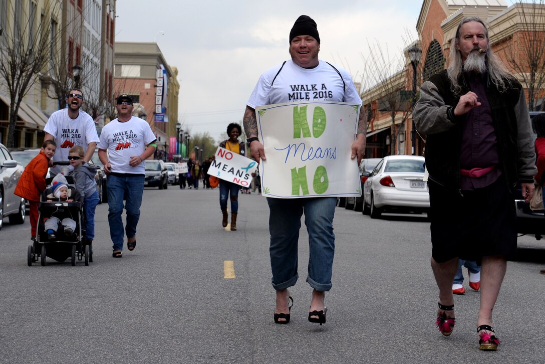 Participants run toward the finish line during the “Walk a Mile in Her Shoes” event in Hampton, Va., April 9, 2016. According to a Department of Defense Sexual Assault Prevention and Response annual report, there were 6,131 reports of sexual assault in the military in 2014. (U.S. Air Force photo by Airman 1st Class Kaylee Dubois)
