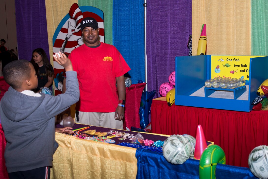 A child plays a game during the “Seussabration” in Hampton, Va., April 9, 2016. The event offered entertainment catered to the children of military members. (U.S. Air Force photo by Airman 1st Class Derek Seifert)