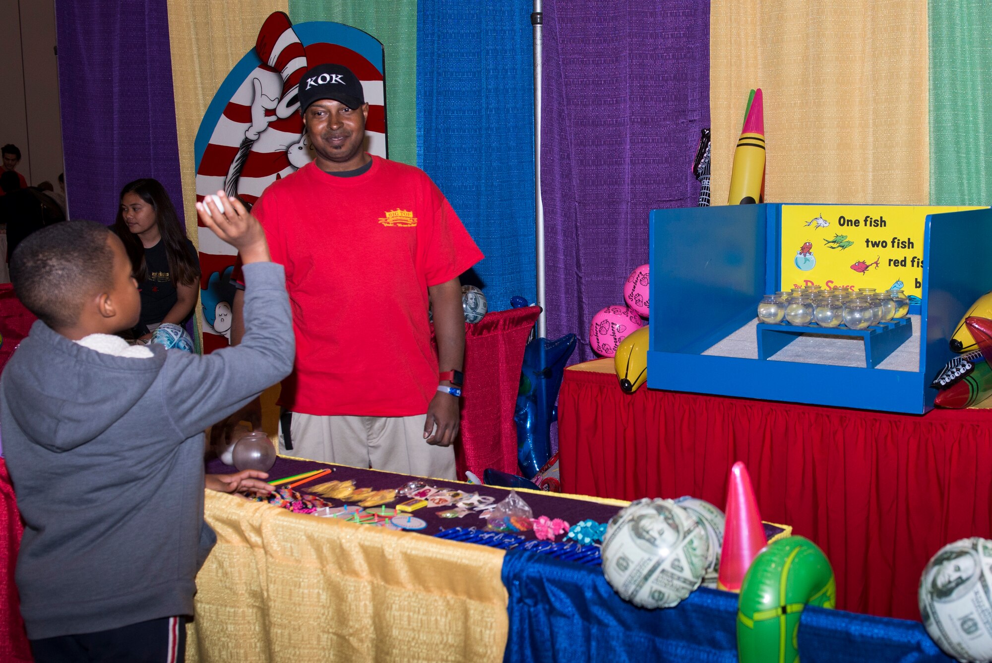 A child plays a game during the “Seussabration” in Hampton, Va., April 9, 2016. The event offered entertainment catered to the children of military members. (U.S. Air Force photo by Airman 1st Class Derek Seifert)