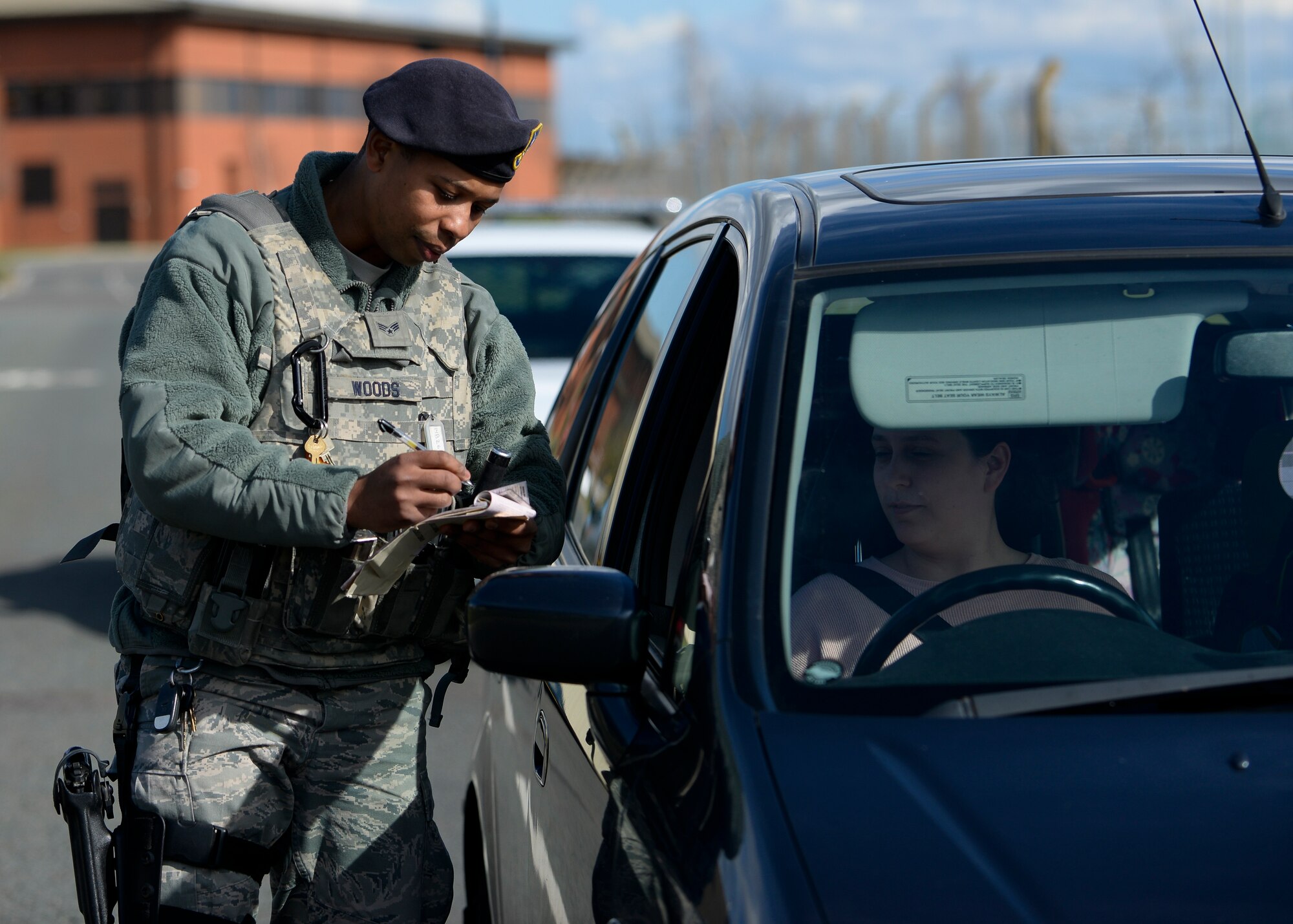 U.S. Air Force Senior Airman Ricardo Woods, 100th Security Forces Squadron defender, performs a routine traffic stop March 29, 2016, on RAF Mildenhall, England. The unit won 2015's Best Large Security Forces Squadron for USAFE-AFAFRICA. (U.S. Air Force photo by Senior Airman Victoria H. Taylor/Released)