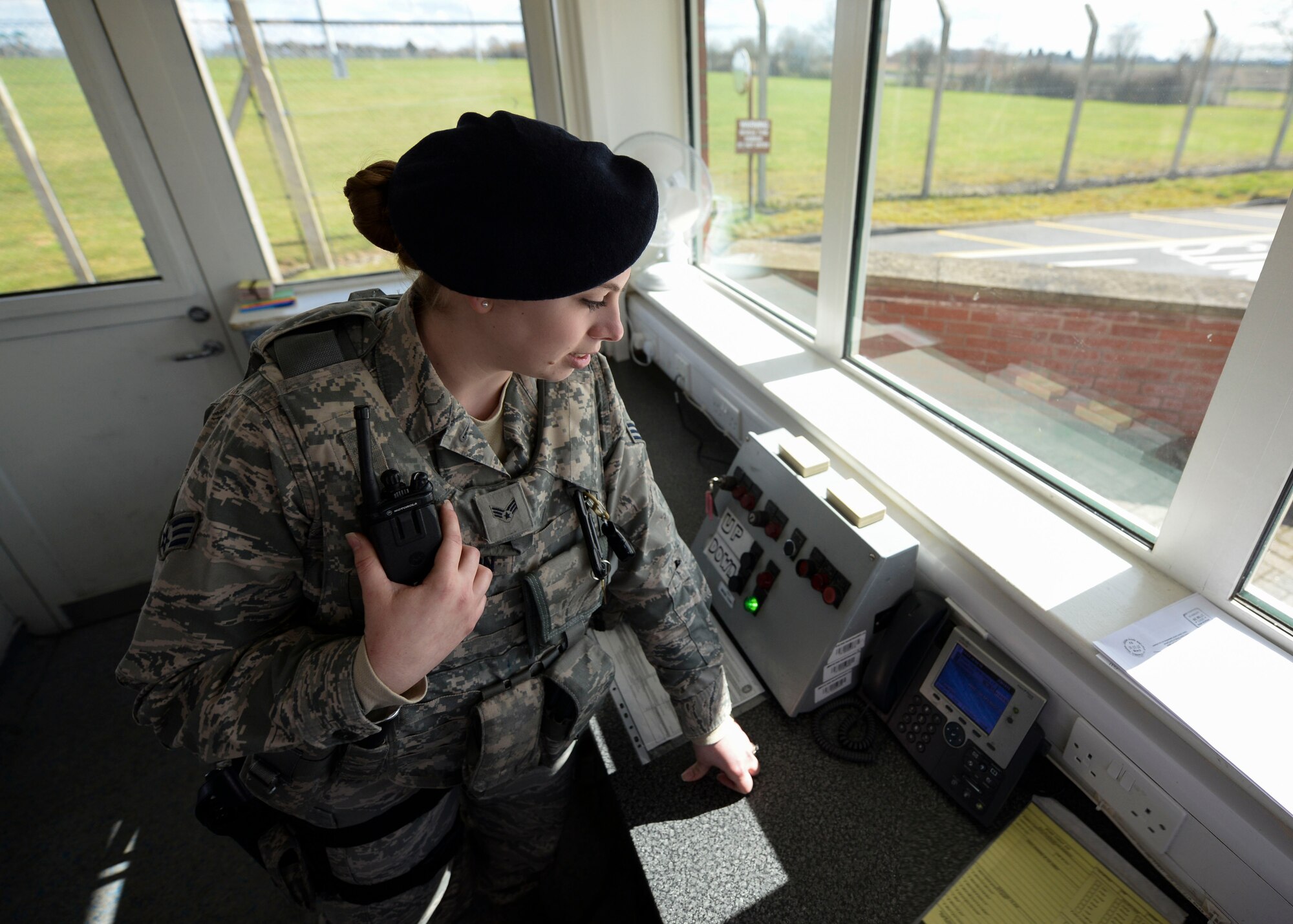 U.S. Air Force Senior Airman Amanda Carlson, 100th Security Forces Squadron defender, reports suspicious activity during an exercise March 29, 2016, on RAF Mildenhall, England. The 100th SFS routinely performs exercises in order to stay vigilant and proficient. (U.S. Air Force photo by Senior Airman Victoria H. Taylor/Released)