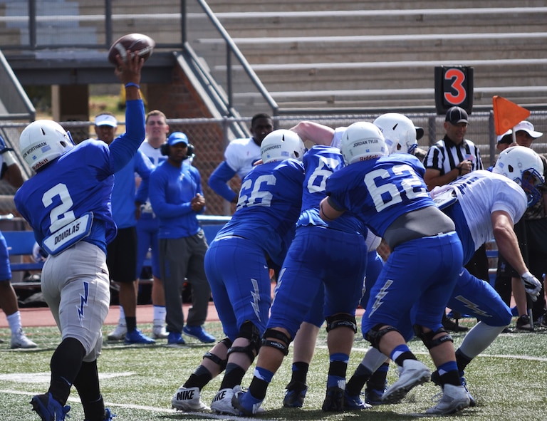 U.S. Air Force Academy quarterback Arion Worthman throws a pass during the Blue-Silver game at Fountain-Fort Carson High School, Saturday, April 9, 2016. The annual intrasquad scrimmage pits the offense against the defense and this year’s game featured local installation commanders serving as honorary coaches. While no score is kept for the scrimmage, Worthman opened the game with a 52-yard touchdown pass. (U.S. Air Force photo/Brian Hagberg)