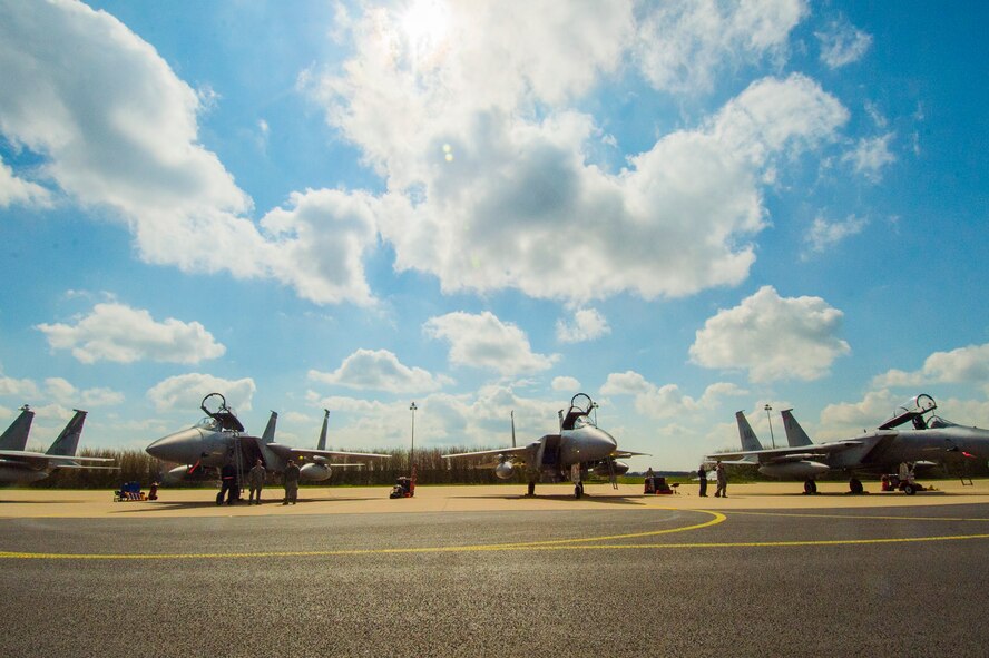 U.S. Air Force F-15C Eagle fighter aircraft assigned to the 131st Expeditionary Fighter Squadron remain on the flightline during a theater security package deployment at Leeuwarden Air Base, Netherlands, April 12, 2016. The F-15s will conduct training alongside NATO allies to strengthen interoperability and to demonstrate U.S. commitment to the security and stability of Europe. The F-15s from the Massachusetts and California Air National Guard are deployed to Europe as part of the TSP. (U.S. Air Force photo by Staff Sgt. Joe W. McFadden/Released)
