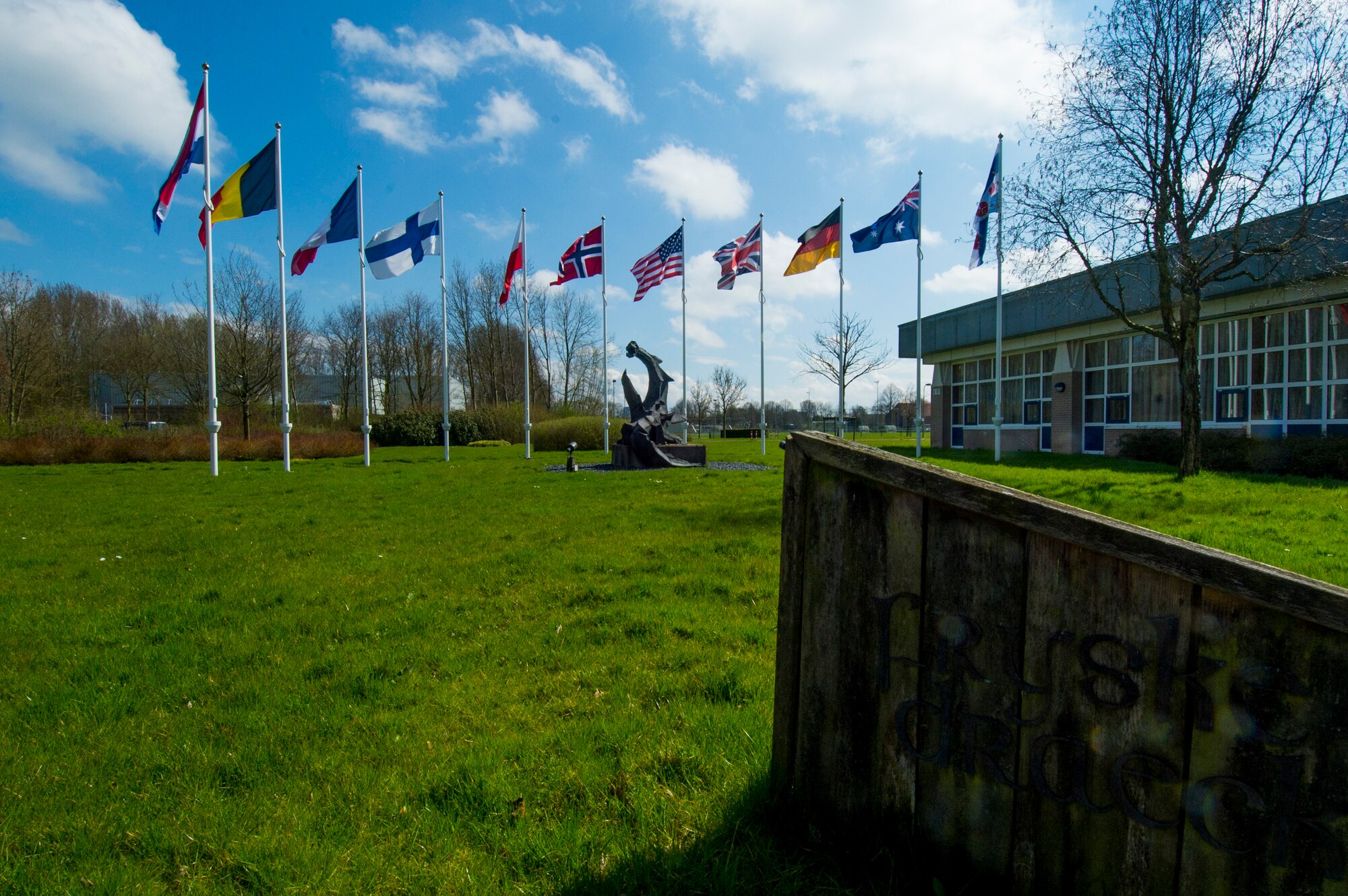 The flags of the national partners of Frisian Flag 2016 remain on display outside of the Frisian Dragon dining facility at Leeuwarden Air Base, Netherlands, April 12, 2016. More than 70 aircraft and personnel from the United States, Netherlands, Belgium, France, Finland, Poland, Norway, United Kingdom, Germany and Australia will participate in Frisian Flag 2016 at Leeuwarden April 11-22, 2016, with as many as 50 executing flight operations each day. (U.S. Air Force photo by Staff Sgt. Joe W. McFadden/Released)