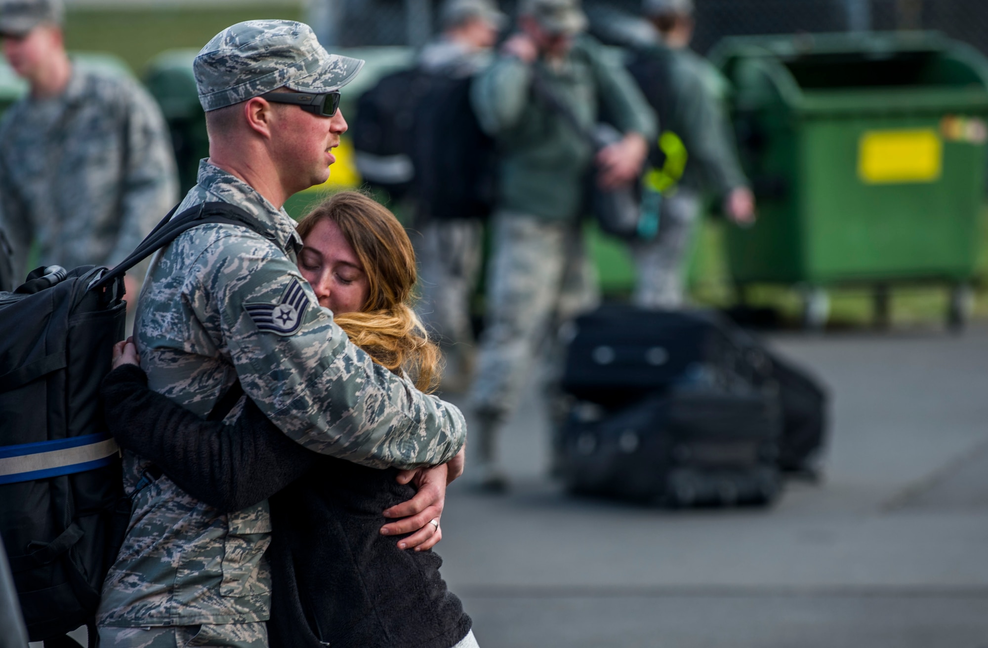 A member of the 480th Aircraft Maintenance Unit hugs his significant other before a deployment in front of the 52nd Logistics Readiness Squadron at Spangdahlem Air Base, Germany, April 7, 2016. The 480th FS deployed to Southwest Asia in support of Operation Inherent Resolve. (U.S. Air Force photo by Airman 1st Class Timothy Kim/Released)
