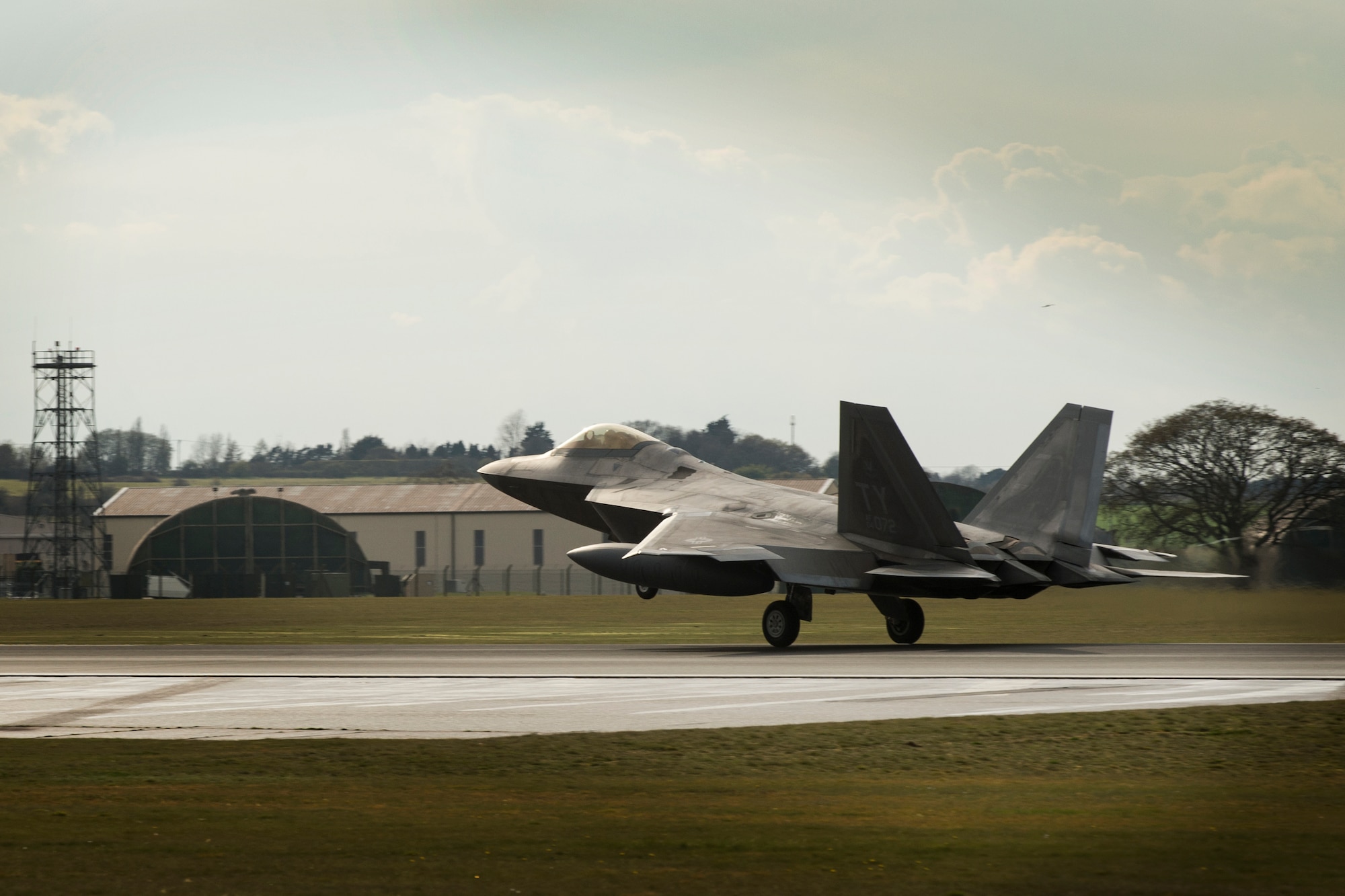 An F-22 Raptor from the 95th Fighter Squadron lands at Royal Air Force Lakenheath, England, April 12, 2016. The aircraft arrival marks the second time the U.S. European Command has hosted a deployment of F-22 aircraft in the EUCOM Area of Responsibility. (U.S. Air Force photo/Airman 1st Class Erin R. Babis) 