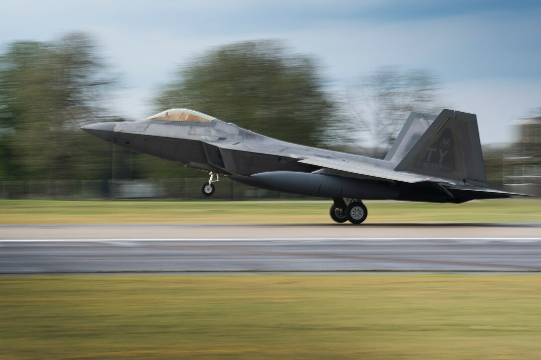 An F-22 Raptor from the 95th Fighter Squadron lands at Royal Air Force Lakenheath, England, April 12, 2016. The aircraft arrival marks the second time the U.S. European Command has hosted a deployment of F-22 aircraft in the EUCOM Area of Responsibility. (U.S. Air Force photo/Airman 1st Class Erin R. Babis)