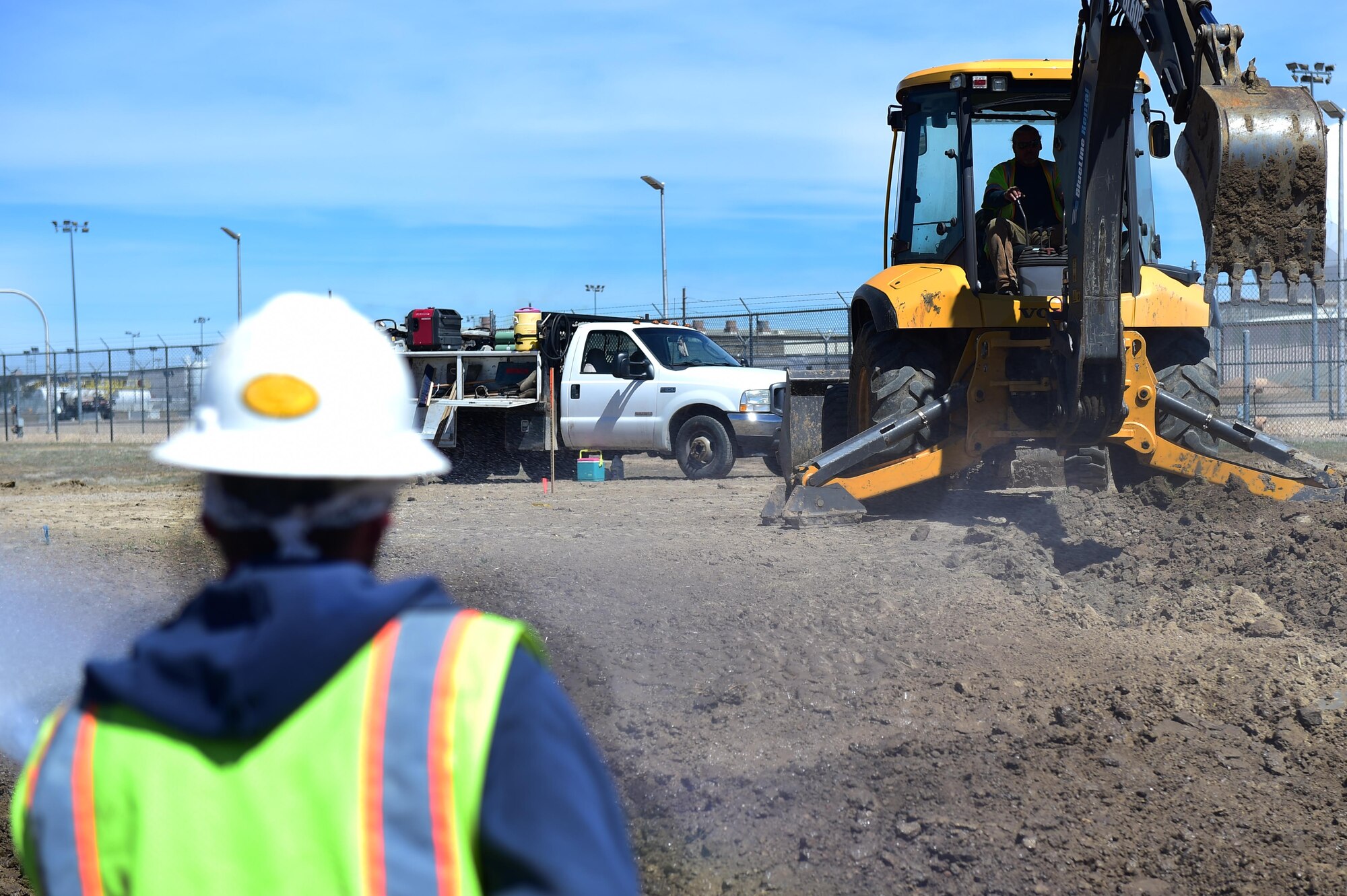 Contractors prepare the intersection of Telluride and Breckenridge for realignment April 6, 2016, on Buckley Air Force base, Colo. The realignment project is part of public campaign Building a Better Buckley Together, which was implemented to maintain and improve both living and working conditions on Buckley. (U.S. Air Force photo by Airman 1st Class Gabrielle Spradling/Released)