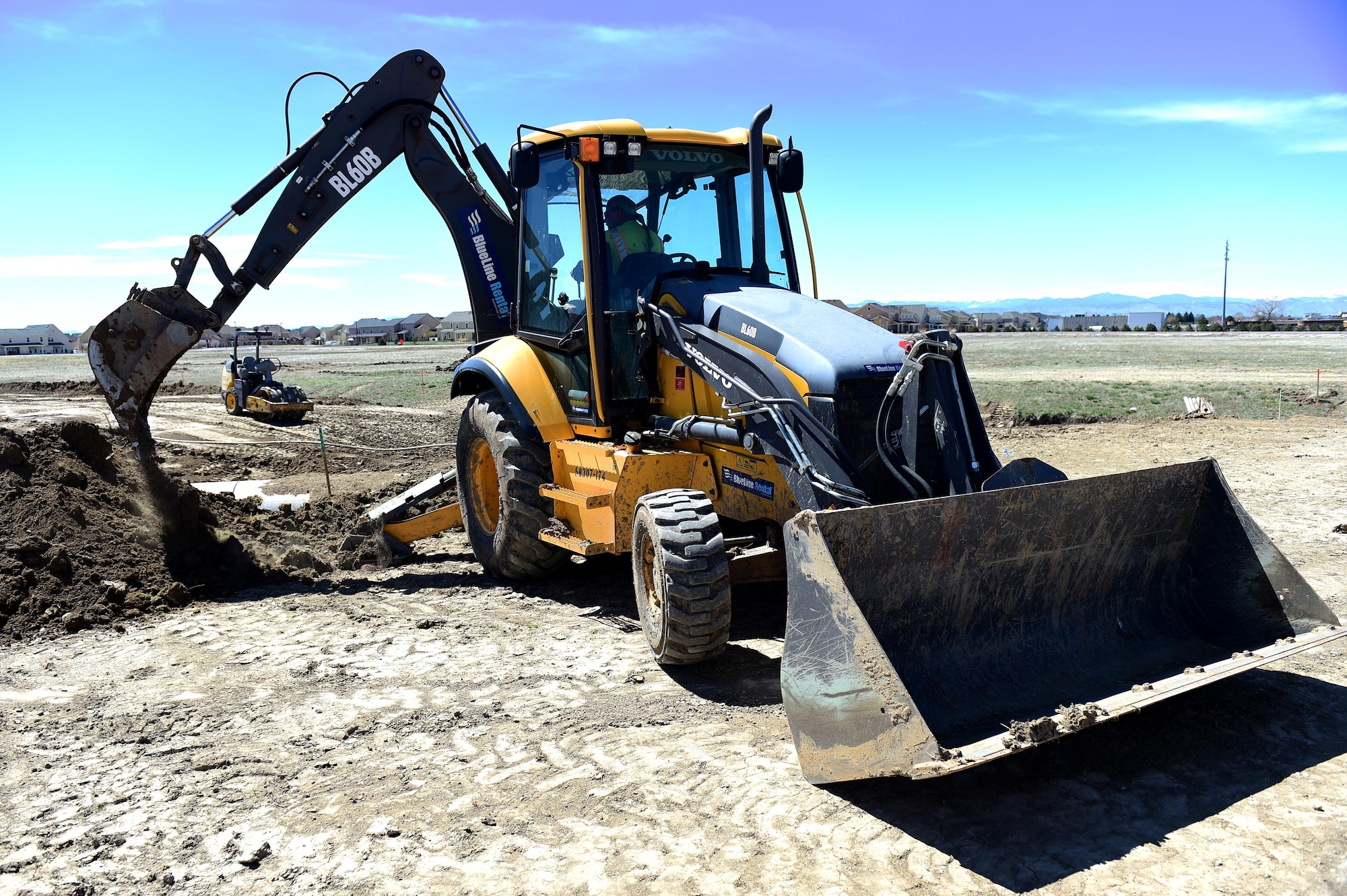 Contractors work on the intersection of Telluride and Breckenridge April 6, 2016, on Buckley Air Force Base, Colo. The construction will realign Telluride Street to make it straight instead of curving around base housing in hopes of improving traffic flow. (U.S. Air Force photo by Airman 1st Class Gabrielle Spradling/Released)