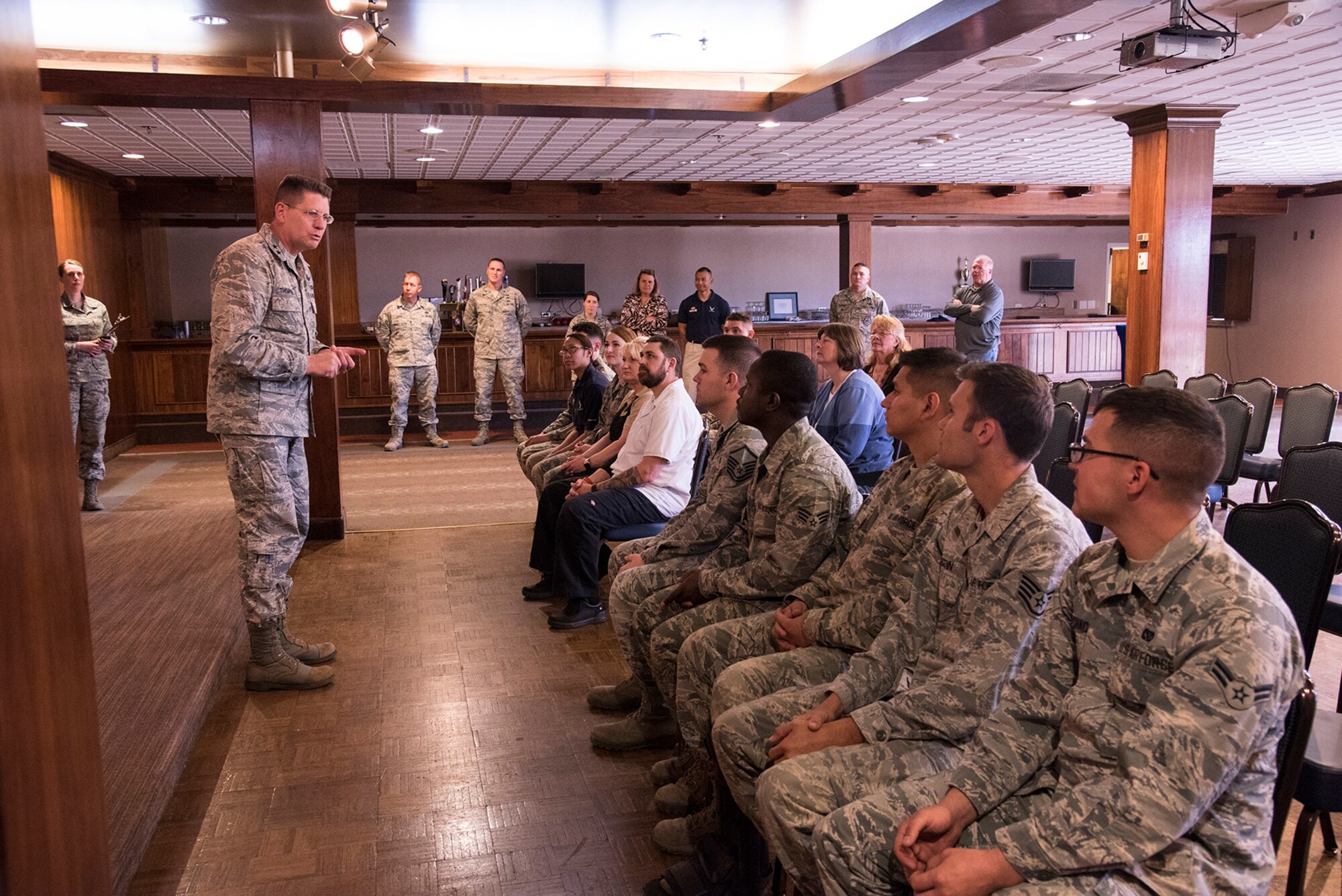 PETERSON AIR FORCE BASE, Colo. – Maj. Gen. David Thompson, Air Force Space Command vice commander, coins several Team Pete personnel at the Peterson Club for their coordination  and involvement in the 2016 AFSPC Heritage Dinner, at Peterson Air Force Base, Colo., April 7, 2016. As part of General John Hyten’s, Air Force Space Command commander, Commanders’ conference, Peterson AFB was presented with the Gen. Thomas S. Moorman Jr Award for being the best wing in 2015. (U.S. Air Force photo by Staff Sgt. Tiffany DeNault)