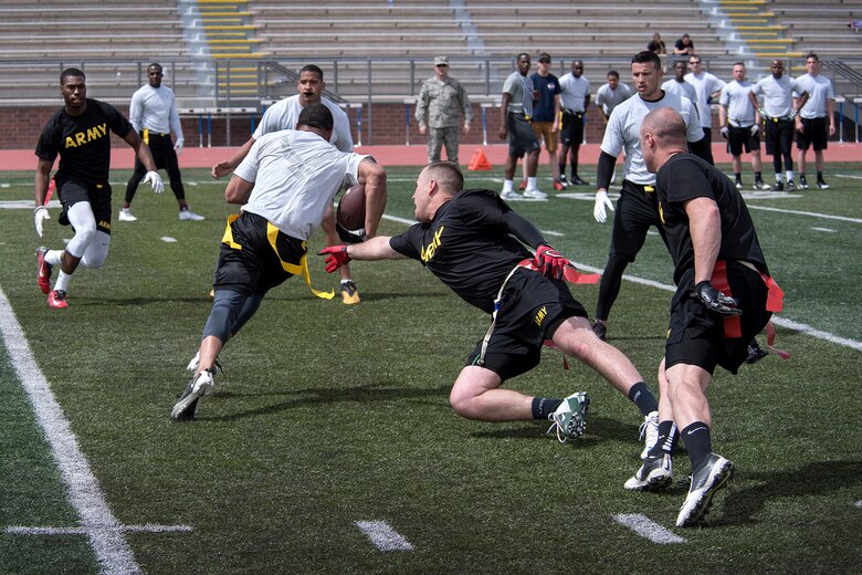 COLORADO SPRINGS, Colo. – Soldiers from Fort Carson and Airmen from Peterson/Schriever Air Force Base’ battle on the field during a flag football game at Falcon-Fort Carson High School on April 9, 2016. The game followed an inter-squad practice scrimmage with United States Air Force Academy Falcons football team. (U.S. Air Force Photo by Craig Denton)
