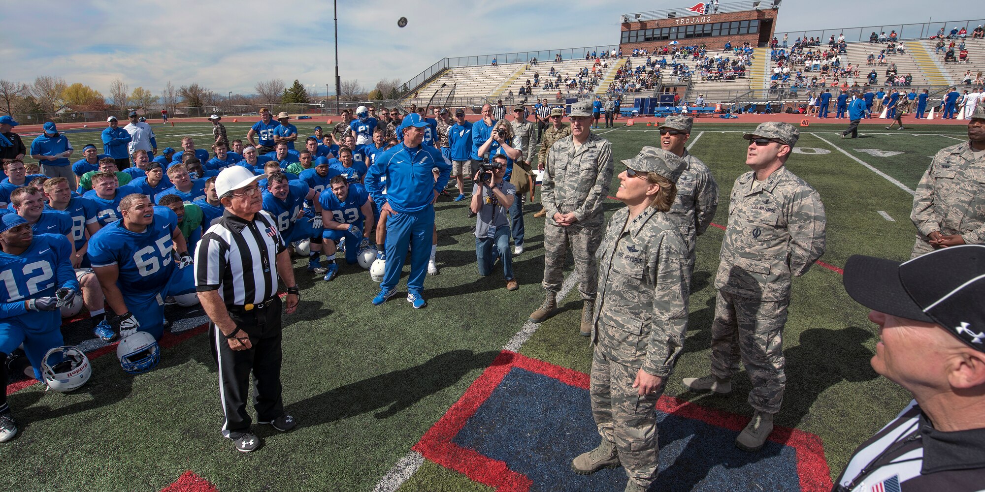 COLORADO SPRINGS, Colo.  – Lt. Gen. Michelle Johnson, United States Air Force Academy superintendent and other distinguished visitors take part in the official coin toss before the United States Air Force Academy Falcons Football Team spring game practice April 9, 2016 at Falcon-Fort Carson High School. Local military commanders were invited to participate as honorary coaches and shadow USAFA football coaches during the game. (U.S. Air Force Photo by Craig Denton)
