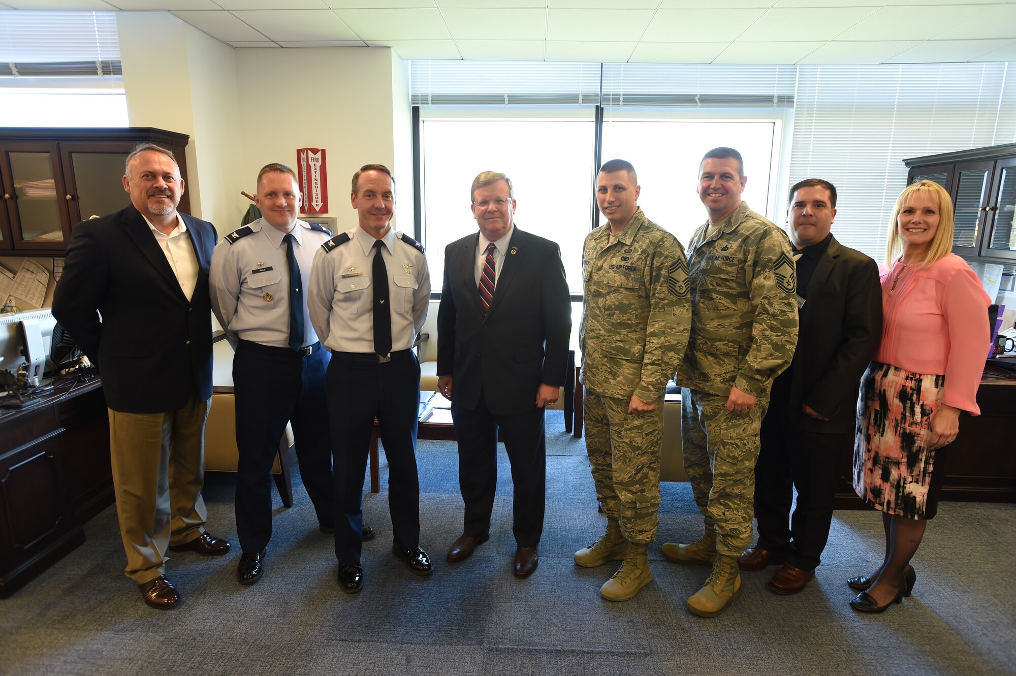 Joint Base Andrews and Army and Air Force Exchange Services leadership pose for a picture after discussing the Base Exchange’s ongoing renovations and expansions at JBA, Md., April 13, 2016. Team Andrews is improving its Exchange facilities to provide a one-stop shop for Andrews Airmen and their families. (U.S. Air Force photo by Senior Airman Joshua R. M. Dewberry/RELEASED)