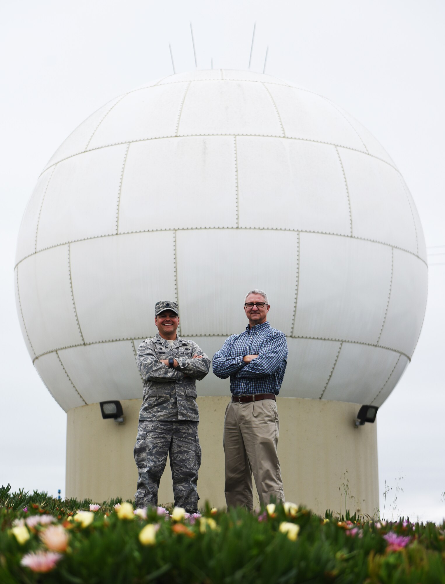 Lt. Col. Jim Horne, 30th Range Maintenance Squadron commander, stands with Bill Prenot, 30th Space Wing director of plans and programs, at a Command Transmitter site, April 12, 2016, Vandenberg Air Force Base, Calif. Prenot was the first commander for the 30th RMS taking command in mid-2003. (U.S. Air Force photo by Senior Airman Ian Dudley/Released)