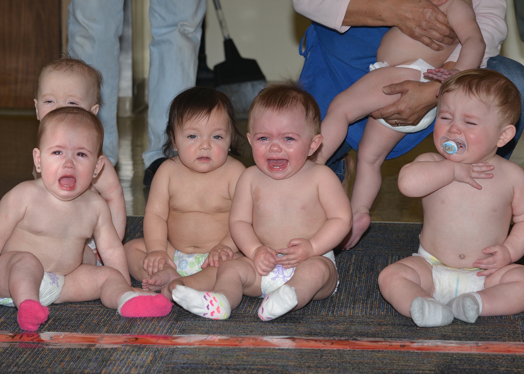 Some babies at the Gibson Child Development Center weren't too thrilled about the “Diaper Derby” on April 7. As part of the observance of the Month of the Military Child in April, the babies were encouraged to crawl down the hall toward their parents, center staff members or toys. The center has several other special events in honor of the month’s designation. (Photo by Todd Berenger)