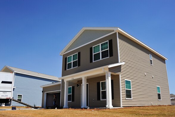 Master Sgt. Kenny Ketcham, an Air Force Lifecycle Management Center logistics superintendent, helps move furniture into his new home April 7. Ketcham and his family were part of the first wave of families to move into the privatized homes on Eglin Air Force Base, Fla. The new development will include multiple playgrounds, a dog-friendly “bark” park, a community center with a fitness room, and a pool. The entire community is estimated to be completed by 2019. (U.S. Air Force Photo/Jasmine Porterfield)