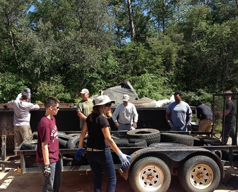 Volunteers help clean an illegal dump site on Eglin reservation during the 2015 Earth Day cleanup. Volunteers are needed for the 2016 Earth Day cleanup event. To volunteer, contact Erica Laine, Eglin volunteer coordinator, at (850) 883-1177.