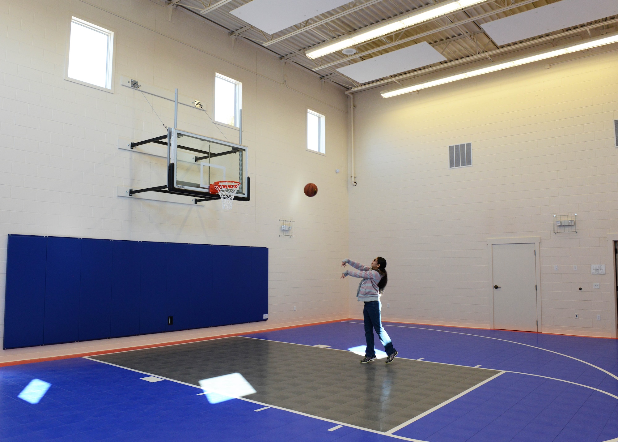 The new Mojave Sky Community Center features a basketball half court along with a workout area. (U.S. Air Force photo by Kenji Thuloweit)