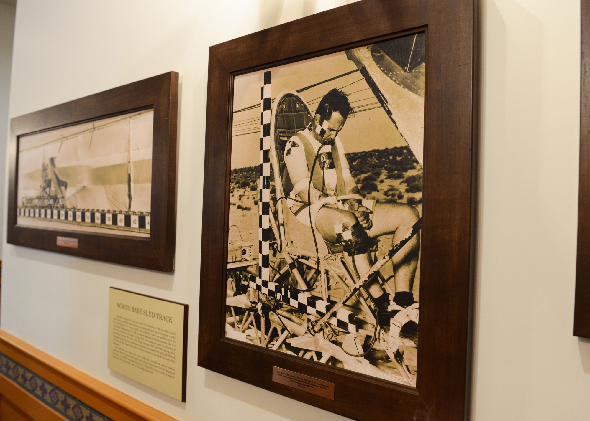 Pictures of historic flight test accomplishments don the interior walls and hallways of the new community center, which officially opened April 13. (U.S. Air Force photo by Kenji Thuloweit)