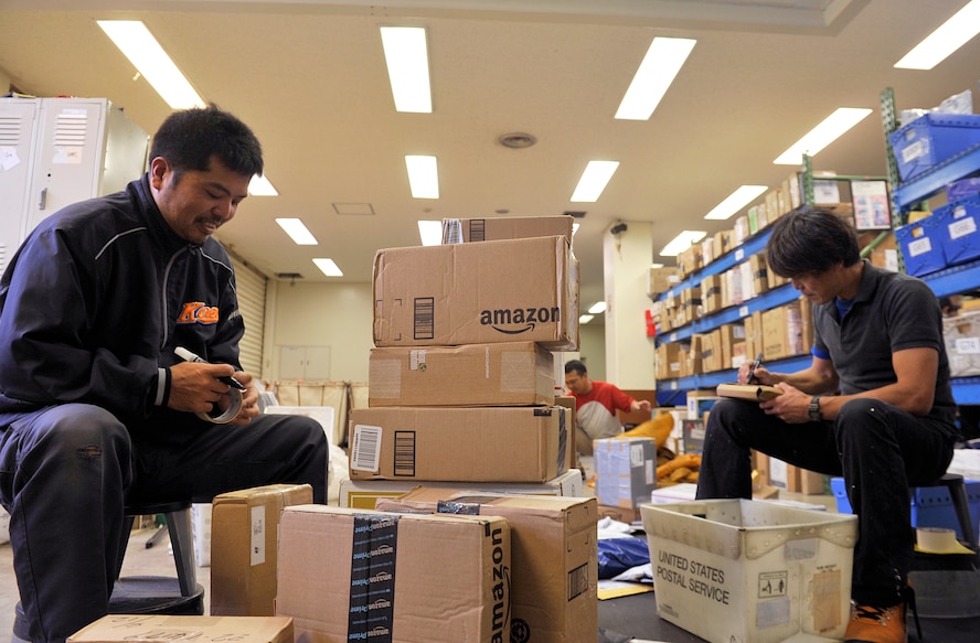 Japanese employees from the Kadena Post Office label a box number on a received package at the Kadena Post Office April 12, 2016, at Kadena Air Base, Japan. The post office offers a variety of services ranging from mailing out parcels, money orders, parcel pick up, and an email notification system, as well as an official mailing center for mission-related shipments. (U.S. Air Force photo by Naoto Anazawa)


