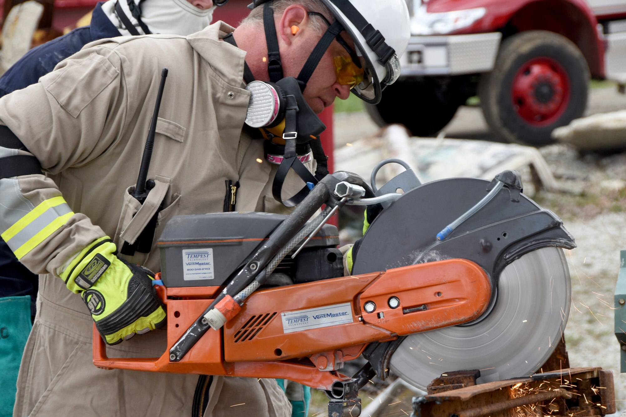 Tech. Sgt.Adam Long, firefighter with the 178th Wing, Springfield, Ohio Air National Guard, cuts a metal grate with a 14 rescue saw to gain access to simulated collapsed building after an earthquake at Muscatatuck Urban Training Center, Butlerville, Ind. April 9.
More than 150 Airman participated in training to prepare them for potential deployments. U.S. Air National Guard photo by Senior Master Sgt. Joseph Stahl/released.