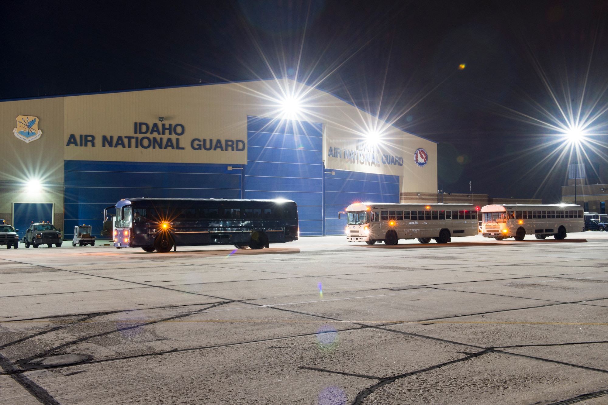 Airmen from the Idaho Air National Guard’s 124th Fighter Wing wait in buses prior to boarding an aircraft at Gowen Field Boise, Idaho April 12, 2016. The Airmen are part of the largest deployment in the Idaho Air National Guard’s history. They are deploying in support of the U.S.-led fight Operation Inherent Resolve. (U.S. Air National Guard photo by Tech. Sgt. Joshua Allmaras/Released)