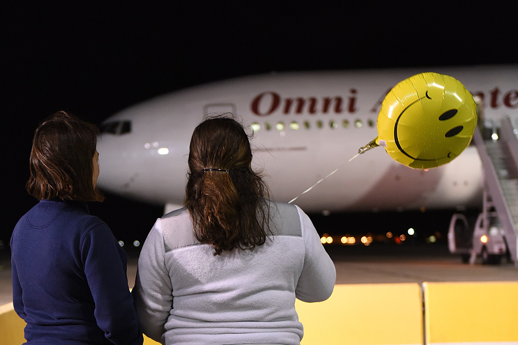 Airmen from the Idaho Air National Guard took a moment and waved farewell to family and friends as they deployed on Tuesday evening, April 12, 2016 to join in combat operations in the Middle East. (U.S. Air National Guard photo by Master Sgt. Becky Vanshur/Released)