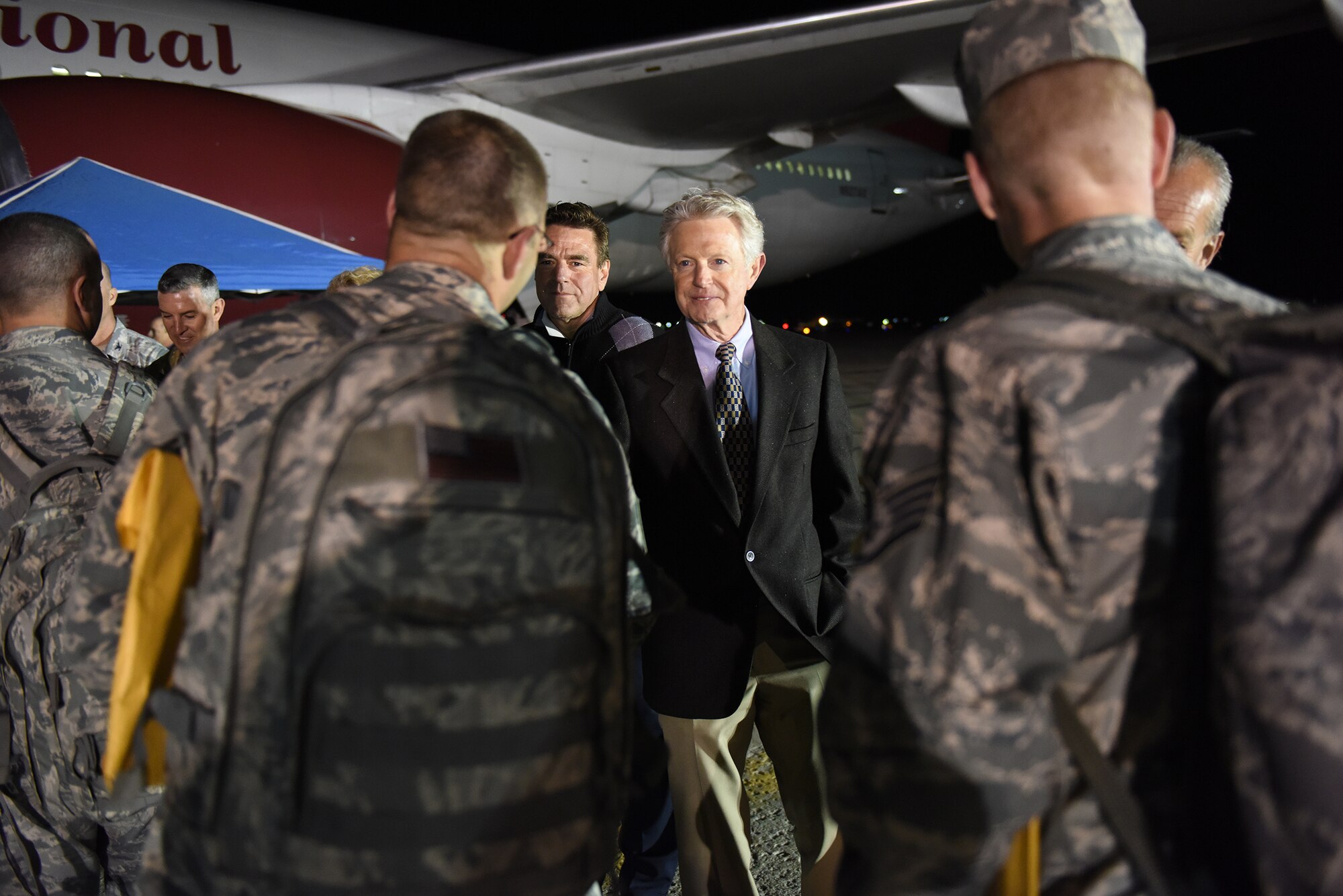 Airmen from the Idaho Air National Guard's 124th Fighter Wing say farewell to family, friends and distinguished visitors on the flight line at Gowen Field in preparation for deployment April 12, 2016. Stan Ridgeway, Mayor of Eagle, Idaho, wishes Airmen a farewell as they depart Tuesday evening. Most of the deploying Guard members will be in the Middle East supporting Operation Inherent Resolve. (U.S. Air National Guard photo by Master Sgt. Becky Vanshur/Released)