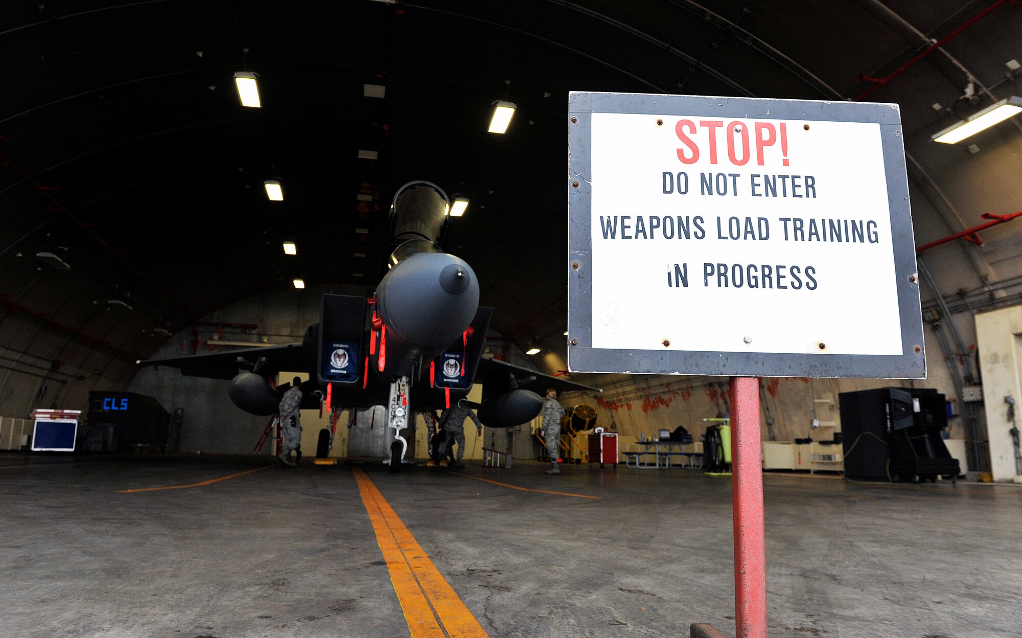 Weapons load crew members from the 67th Aircraft Maintenance Unit load weapons onto an F-15 Eagle fighter aircraft during training April 13, 2016, at Kadena Air Base, Japan. The 18th Maintenance Group, with its six squadrons, maintains combat-ready aircraft to support air operations directed by the Pacific Command Commander, through Pacific Air Forces and 5th Air Force. (U.S. Air Force photo by Naoto Anazawa)