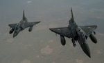 Two French Mirage 2000Ds fly over Iraq in support of Operation Inherent Resolve April 8, 2016. A coalition of regional and international nations have joined together to defeat ISIL and the threat they pose to Iraq, Syria, the region and the wider international community. (U.S. Air Force photo by Staff Sgt. Corey Hook)