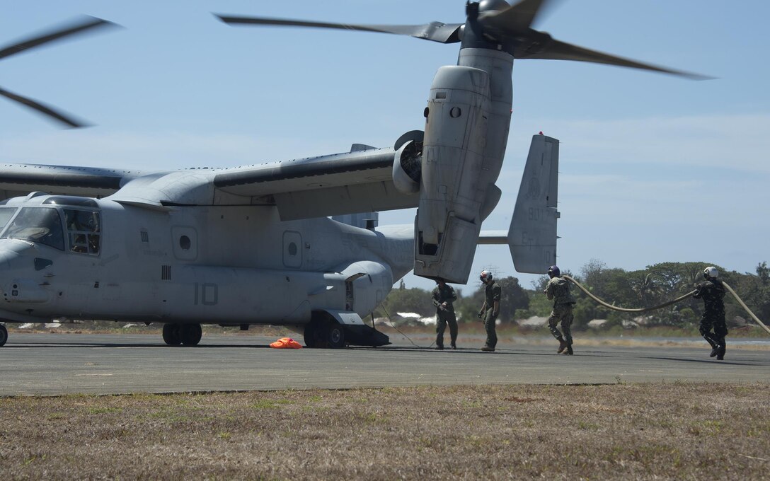 U. S. Armed Forces and Philippine Air Force members refuel a MV-22 Osprey aircraft from the Combined Logistical Point (CLP) in Puerto Princesa, Philippines, demonstrating the ability to resupply aircraft and ground units from remote locations during exercise Balikatan, April 11, 2016. Balikatan is an annual Philippine-U.S. military bilateral training exercise that is a signature element of the Philippine-U.S. alliance focused on a variety of missions, including humanitarian assistance, maritime law enforcement, and environmental protection.