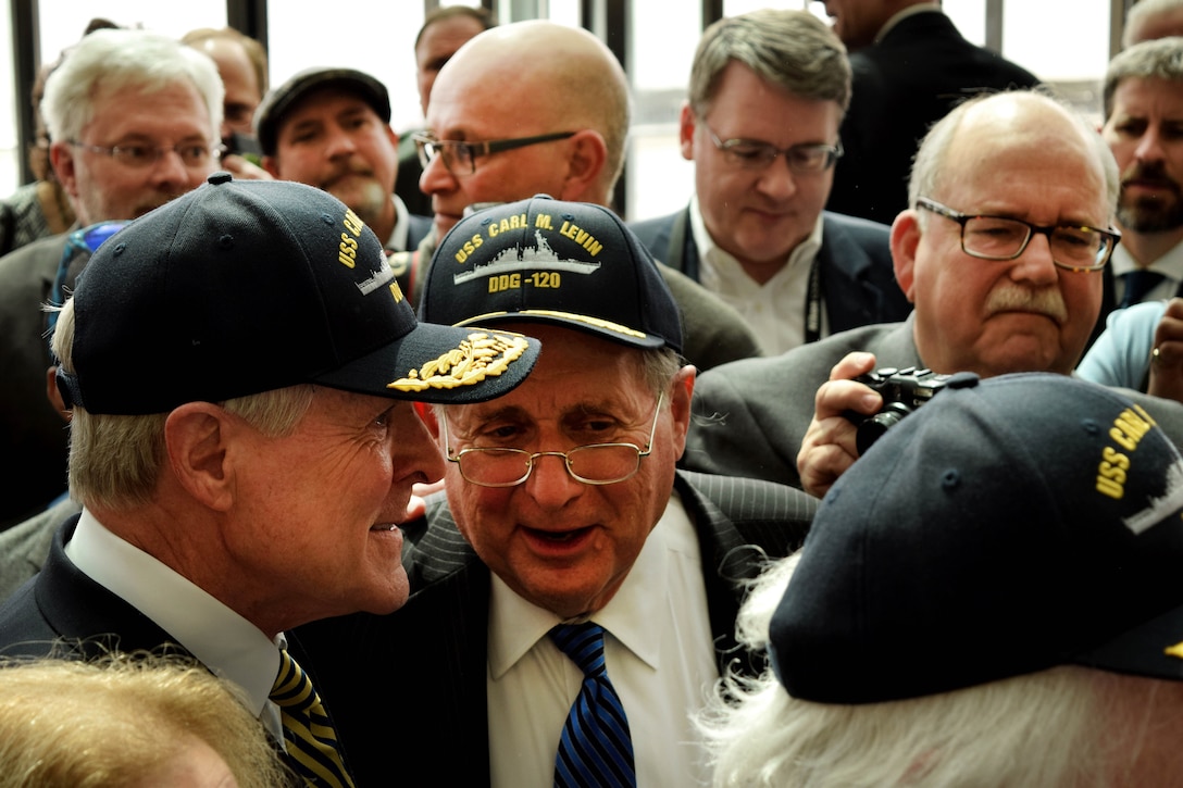 Navy Secretary Ray Mabus, left, and former U.S. Sen. Carl M. Levin celebrate the naming of the Navy’s newest Arleigh Burke class destroyer in Levin’s honor in Detroit, April 11, 2016. Navy photo by Chief Linda J. Andreoli