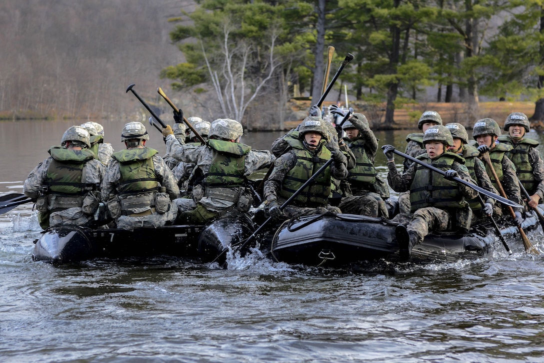 The U.S. Academy team, left, paddles by South Korean cadets during water crossing as part of the 2016 Sandhurst Competition at West Point, N.Y., April 8-9, 2016. Army photo by Sgt. 1st Class Brian Hamilton