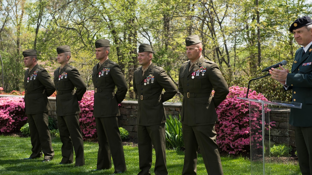 Marine Corps Major Michael Radynski, Scott Benninghoff, Richard R. Schellhaas, Justin Jones and Chief Warrant Officer Jake Geary receive praise following an award ceremony from Demarks only four star general Chief of Defence Denmark General Peter Bartram. The award ceremony was held in the garden of the Danish Embassy in Washington D.C.  April 13, 2016. (Marine Corps Photo by Lance Cpl. Timothy R. Smithers/ Released)