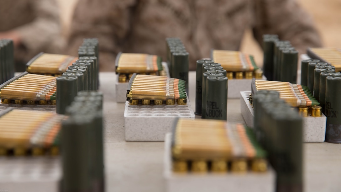 Marines wait for ammunition during the Western Regional Combat Match at Marine Corps Air Ground Combat Center, April 7, 2016. Marines fired buckshot, slug, 5.56mm, and 9mm rounds during the competition. 