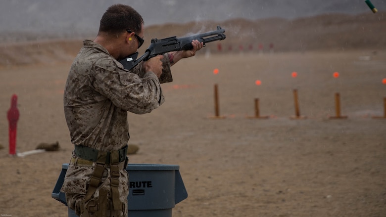 Cpl. James Tipton, Edson Range marksmanship coach, Marine Corps Recruit Depot San Diego, fires a Benelli M1014 shotgun at the Western Regional Combat Matchat Marine Corps Air Ground Combat Center, April 8, 2016. Tipton and his team from MCRD San Diego took gold in the team competition. 