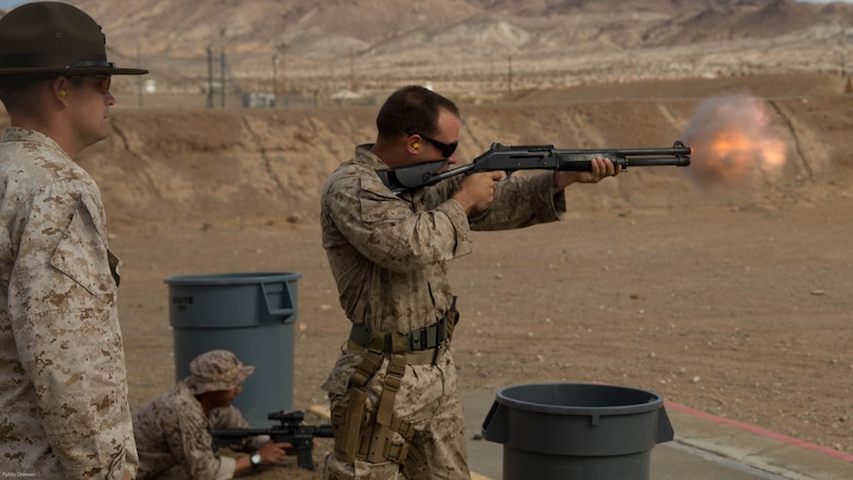 Cpl. James Tipton, Edson Range marksmanship coach, Marine Corps Recruit Depot San Diego, fires a Benelli M1014 shotgun at the Western Regional Combat Match at Marine Corps Air Ground Combat Center, April 8, 2016. Tipton and his team from MCRD San Diego took gold in the team competition. 