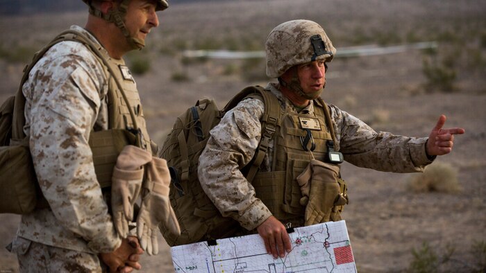 Colonel William Vivian, commanding officer, 7th Marine Regiment, escorts Maj. Gen. Daniel O’Donohue, Commanding General, 1st Marine Division, to the Combat Operations Center in the Lead Mountain training area during the regiment’s Combined Arms Live Fire Exercise aboard Marine Corps Air Ground Combat Center, April 5, 2016. CALFEX served as the kinetic portion of Desert Scimitar 16, an annual 1st Marine Division training evolution. 