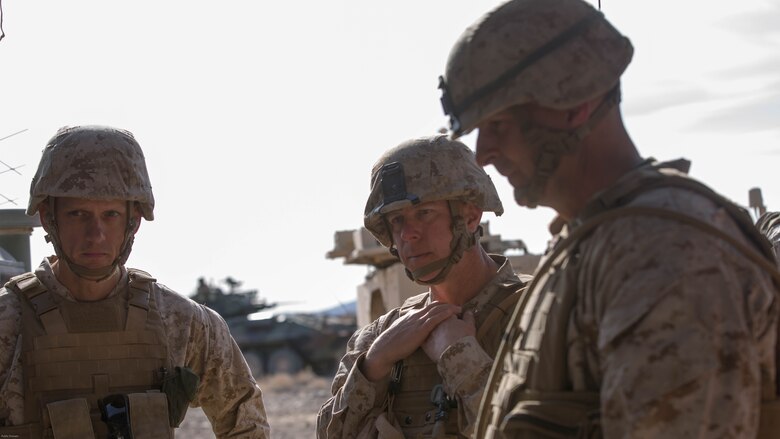 Lt. Col Andrew Nelson, commanding officer, 3rd Battalion, 7th Marine Regiment, Col. William Vivian, commanding officer, 7th Marine Regiment, and Maj. Gen. Daniel O’Donohue, Commanding General, 1st Marine Division, receive a brief on the maneuver of forces during the defense portion of 7th Marine Regiment’s Combined Arms Live Fire Exercise at Marine Corps Air Ground Combat Center April 6, 2016. CALFEX served as the kinetic portion of Desert Scimitar 16, an annual 1st Marine Division training evolution. 