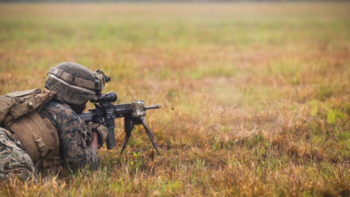 Lance Cpl. Tevin Brown, an automatic rifleman with 2nd Battalion, 8th Marine Regiment, engages simulated enemy targets during a platoon attack training event at Marine Corps Base Camp Lejeune, N.C., April 12, 2016.  The training focused on guaranteeing the Marines are confident in employing their combat skills in future foreign hostile environments. 