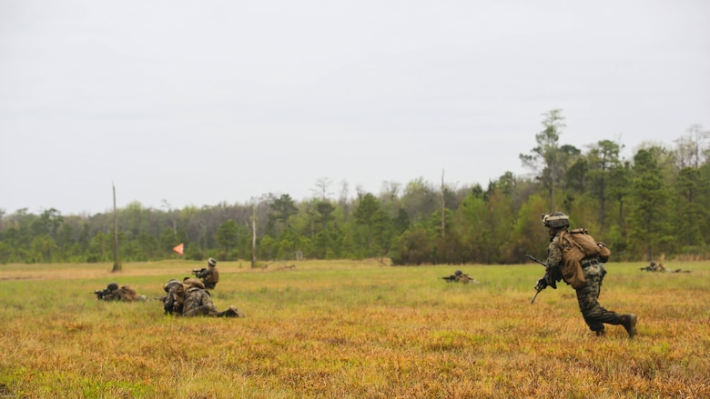 Sgt. Eric Aldridge, squad leader for 2nd Battalion, 8th Marine Regiment, runs to get into a prone position during a platoon attack training event at Marine Corps Base Camp Lejeune, N.C., April 12, 2016. The training allowed leaders to identify areas within the unit that required additional practice to improve their combat effectiveness.