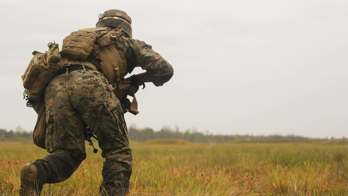 Lance Cpl. Tevin Brown, an automatic rifleman with 2nd Battalion, 8th Marine Regiment, charges toward an objective during a platoon attack training event at Marine Corps Base Camp Lejeune, N.C., April 12, 2016. The training event afforded the Marines an opportunity to develop and improve their strategies under stressful combat situations. 