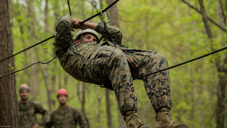 Sgt. Chris Ginandt, an instructor for the Assault Climbers Course, slides down a one-rope bridge to demonstrate the capabilities and the method of descent to the students of the course at Marine Corps Base Camp Lejeune, N.C., April 12, 2016. These bridges allow Marines from the 22nd Marine Expeditionary Unit to conduct cliff assaults, and move supplies and themselves safely across a river or cavern.
