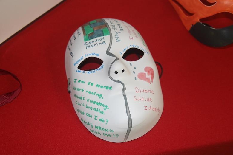 Masks decorated by Marines in the Consolidated Substance Abuse Counseling Center’s intensive outpatient treatment program in March are displayed during a Family Advocacy Program open house Apr. 7. Participants used the masks to express the feelings they use alcohol to cover or hide from the world. April is national Alcohol Awareness Month.