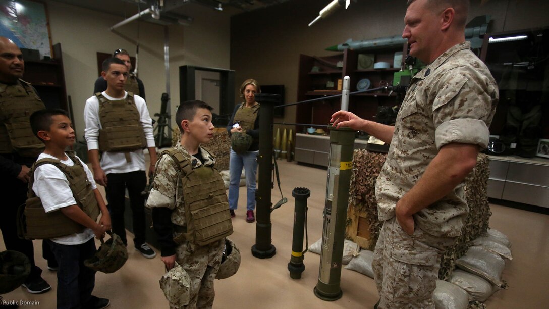 Nathan Aldaco, a 12 year-old boy with hypoplastic left heart syndrome, learns about explosive ordnance during a Make-A-Wish event supported by 7th Engineer Support Battalion, 1st Marine Logistics Group, at Marine Corps Base Camp Pendleton, California, March 24, 2016. Marines with 7th ESB and Explosive Ordnance Disposal helped to make Nathan’s wish of training with Marines come true by demonstrating the capabilities of their EOD robots and detonating TNT, C4, dynamite and blasting caps, while the heavy equipment operators gave him the opportunity to ride the D7 dozer and the excavator, in which he dug a pit, built a berm, and broke several large tree trunks.  