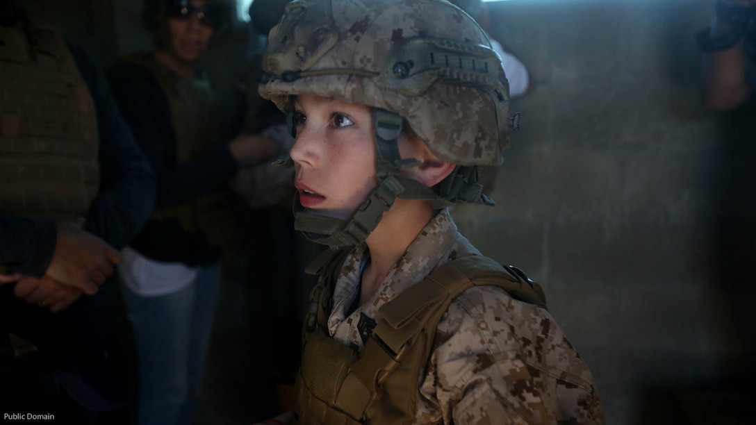 Nathan Aldaco, a 12 year-old boy with hypoplastic left heart syndrome, gets a safety brief before watching explosives detonate during a Make-A-Wish event supported by 7th Engineer Support Battalion, 1st Marine Logistics Group, at Marine Corps base Camp Pendleton, California, March 24, 2016. Marines with 7th ESB and Explosive Ordnance Disposal helped to make Nathan’s wish of training with Marines come true by demonstrating the capabilities of their EOD robots and detonating TNT, C4, dynamite and blasting caps, while the heavy equipment operators gave him the opportunity to ride the D7 dozer and the excavator, in which he dug a pit, built a berm, and broke several large tree trunks.
