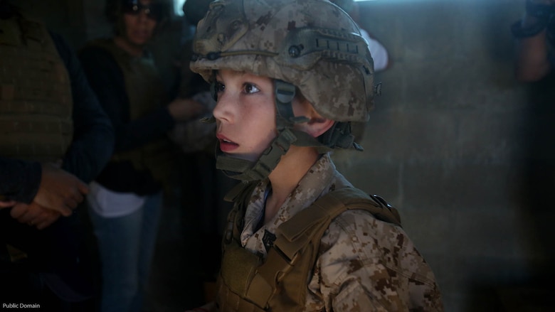 Nathan Aldaco, a 12 year-old boy with hypoplastic left heart syndrome, gets a safety brief before watching explosives detonate during a Make-A-Wish event supported by 7th Engineer Support Battalion, 1st Marine Logistics Group, at Marine Corps base Camp Pendleton, California, March 24, 2016. Marines with 7th ESB and Explosive Ordnance Disposal helped to make Nathan’s wish of training with Marines come true by demonstrating the capabilities of their EOD robots and detonating TNT, C4, dynamite and blasting caps, while the heavy equipment operators gave him the opportunity to ride the D7 dozer and the excavator, in which he dug a pit, built a berm, and broke several large tree trunks.
