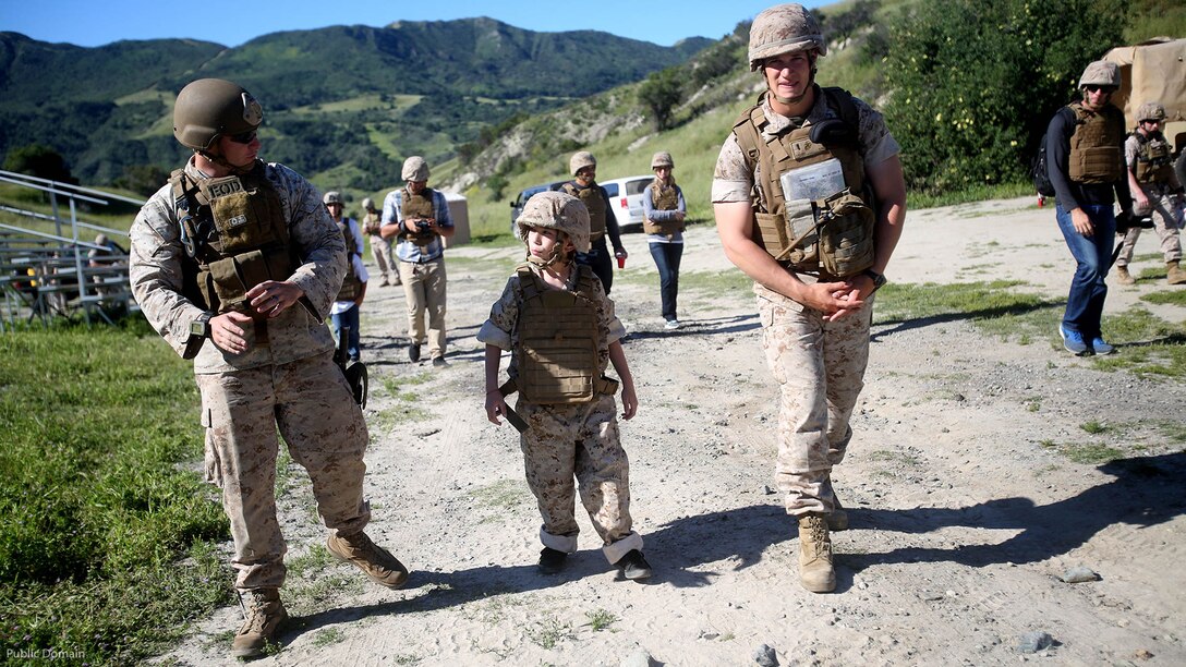 Nathan Aldaco, a 12 year-old boy with hypoplastic left heart syndrome, walks with Marines to a demolition site during a Make-A-Wish event supported by 7th Engineer Support Battalion, 1st Marine Logistics Group, at Marine Corps Base Camp Pendleton, California, March 24, 2016. The Marines helped to make Nathan’s wish of training with Marines come true by demonstrating the capabilities of their EOD robots and detonating TNT, C4, dynamite and blasting caps. 